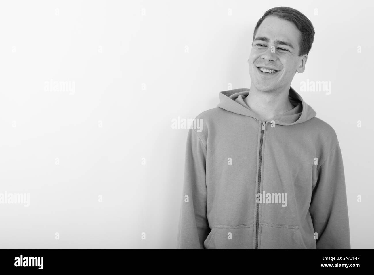 Portrait of young handsome man wearing hoodie in black and white Stock ...