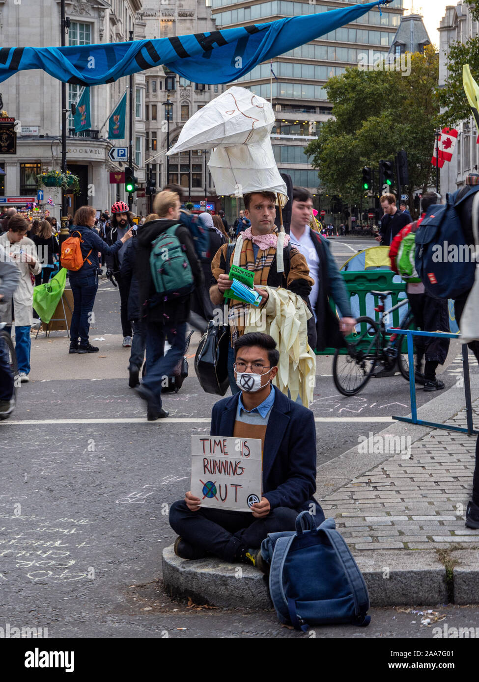 London, England, UK - October 10, 2019: People carry placards and leaflets during an Extinction Rebellion protest in London's Trafalgar Square. Stock Photo