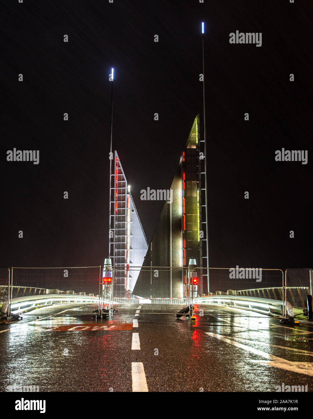 Poole, England, UK - October 3, 2019: Rain falls on the broken Twin Sails Bridge which is fenced off and left lifted while awaiting repair on Poole Ha Stock Photo