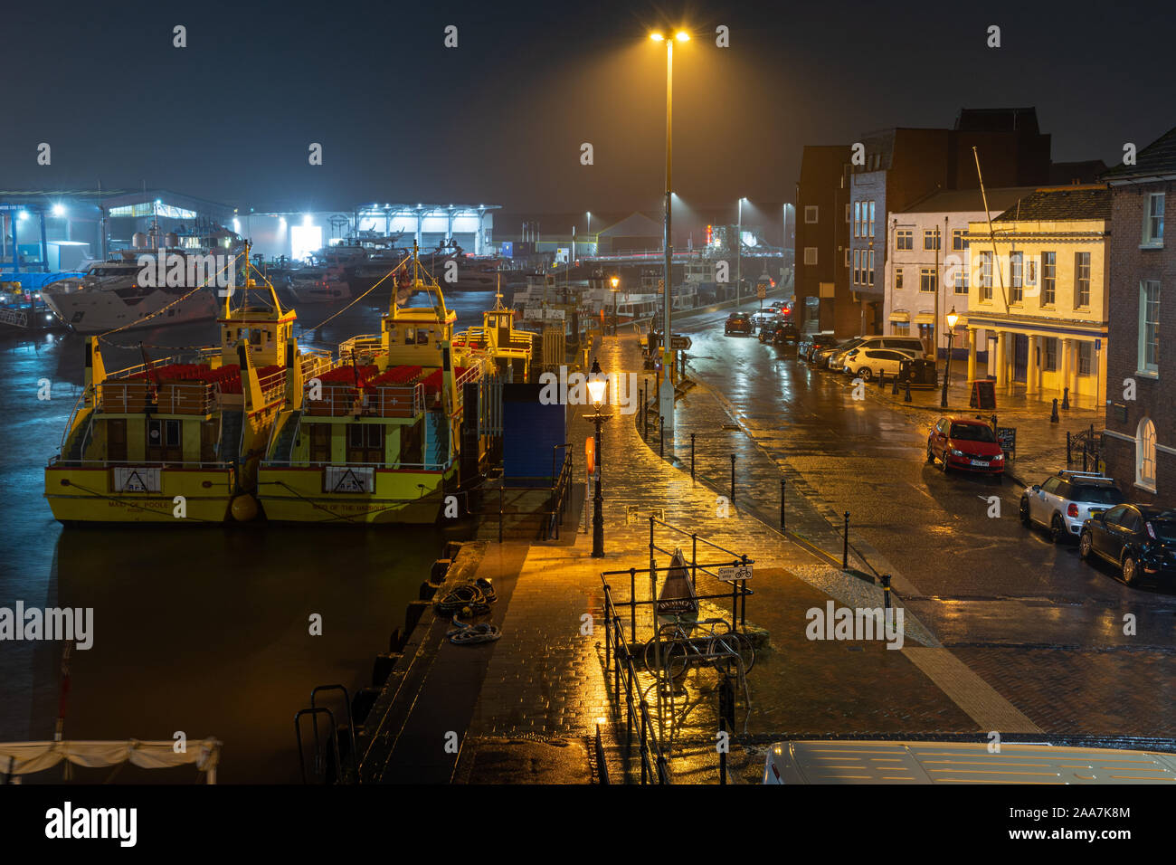Poole, England, UK - October 3, 2019: Rain falls on the Quay and boats moored in Poole Harbour in Dorset. Stock Photo