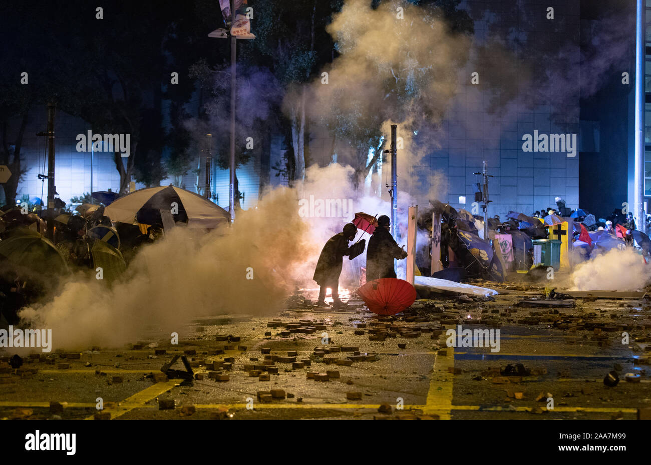 Hong Kong, China. 18th Nov, 2019. Teargas fired at protesters on Cheong Wan Road during the demonstration.Siege at Polytechnic University. Police surround the university campus after pro-democratic protesters blocked the cross-harbour tunnel and the major road outside the campus. Hong Kong protest continue for the sixth months. A citywide strike called for started on Monday 11 November, 2019 which brought parts of Hong Kong to halt as MTR stations closed and multiple roadblocks were erected. Credit: SOPA Images Limited/Alamy Live News Stock Photo