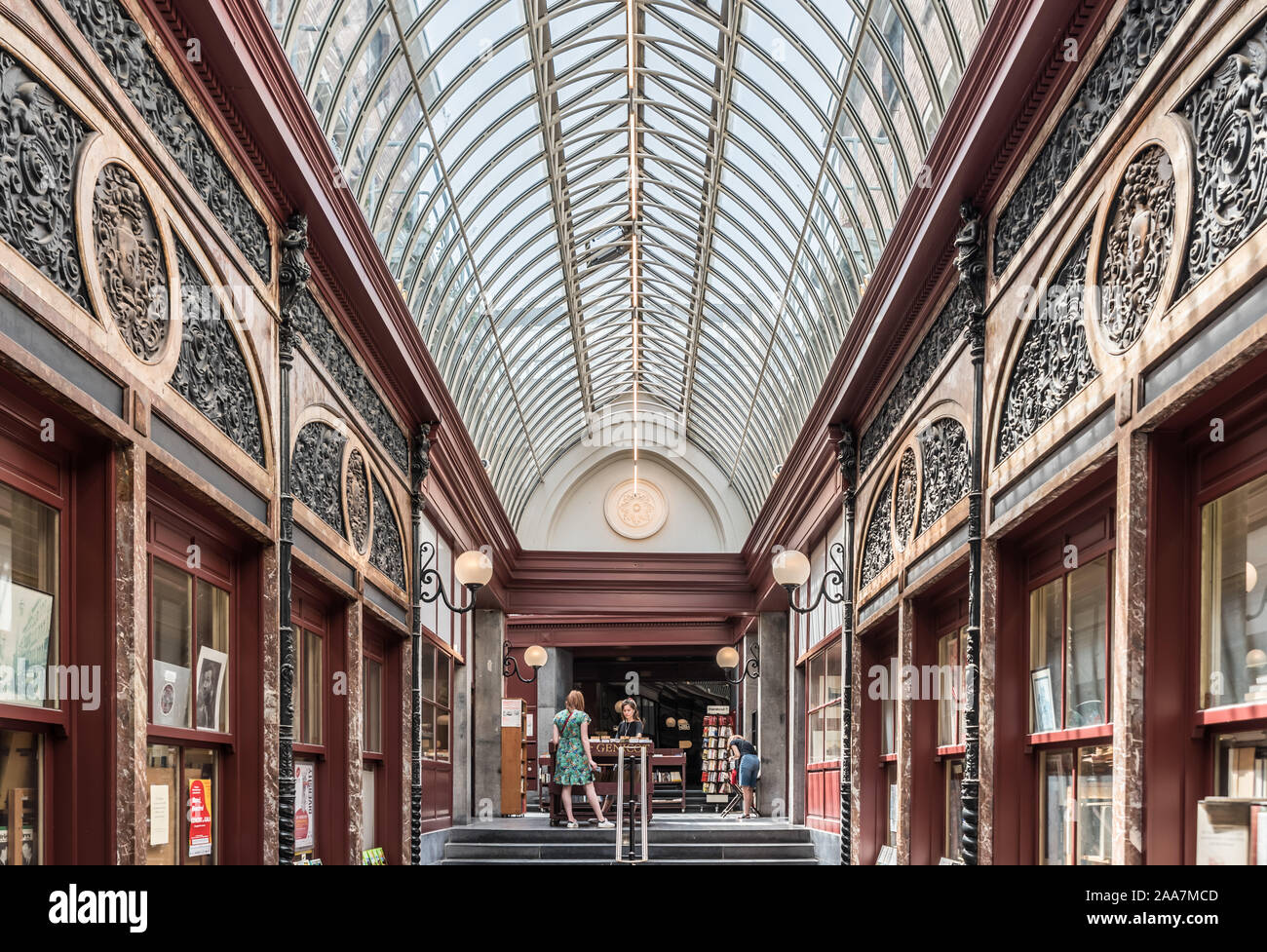 Brussels Old Town / Belgium - 06 25 2019: Decorated arcades and hall of the Genicot Library in the Bortier Gallery in Art Nouveau and neo Renaissance Stock Photo