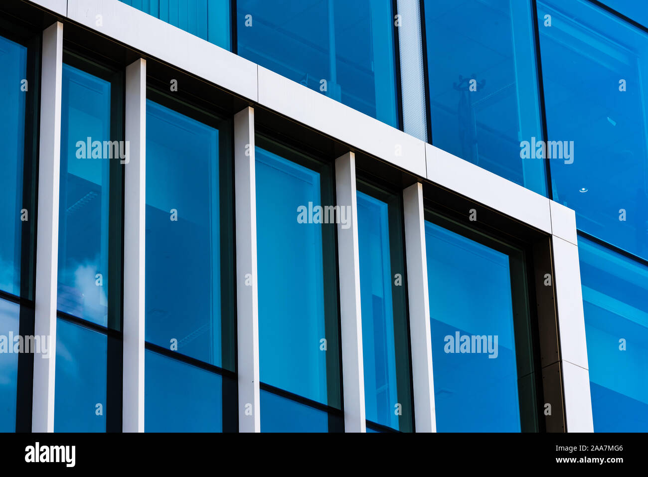 Brussels City Center / Belgium - 07 04 2019: Abstract view of blue glass and steel of the contemporary offices of the Brussels Administration Stock Photo