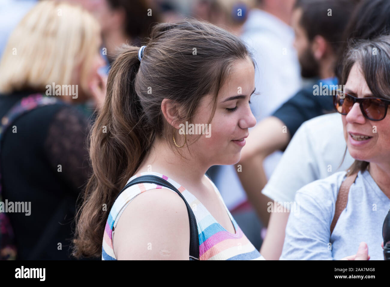 Brussels Old Town / Belgium - 07 05 2019: Laughing teenage daucghter and her mother talking at Grande Place Brussels Stock Photo