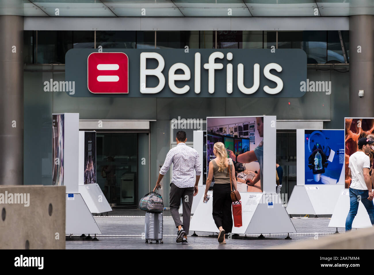 Brussels Old Town / Belgium - 07 05 2019: office people and bank clients walking out of the Belfius banking tower at Place Rogier Stock Photo
