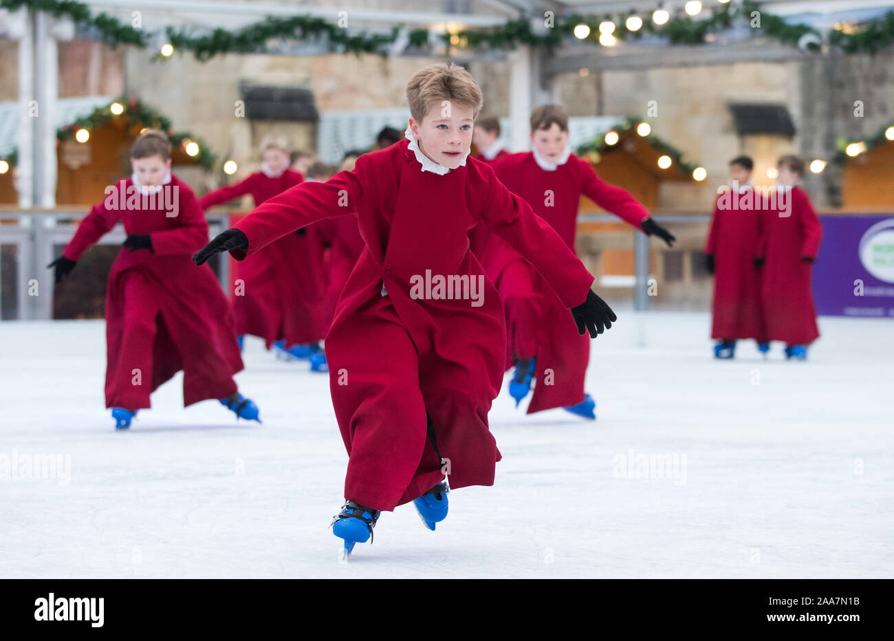 Choristers of Winchester Cathedral skate on the cathedral's ice rink, situated in the centre of the cathedral's Inner Close, which will be open from Thursday November 21 until Sunday January 5, 2020. Stock Photo