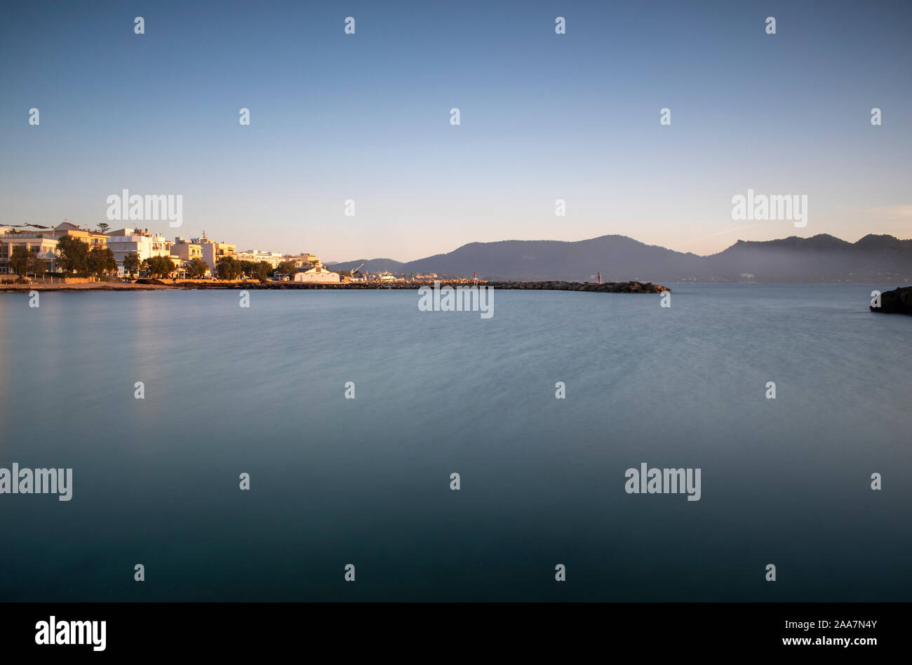 View towards Cala Bona Majorca at Sunrise with a silky smooth sea. Stock Photo