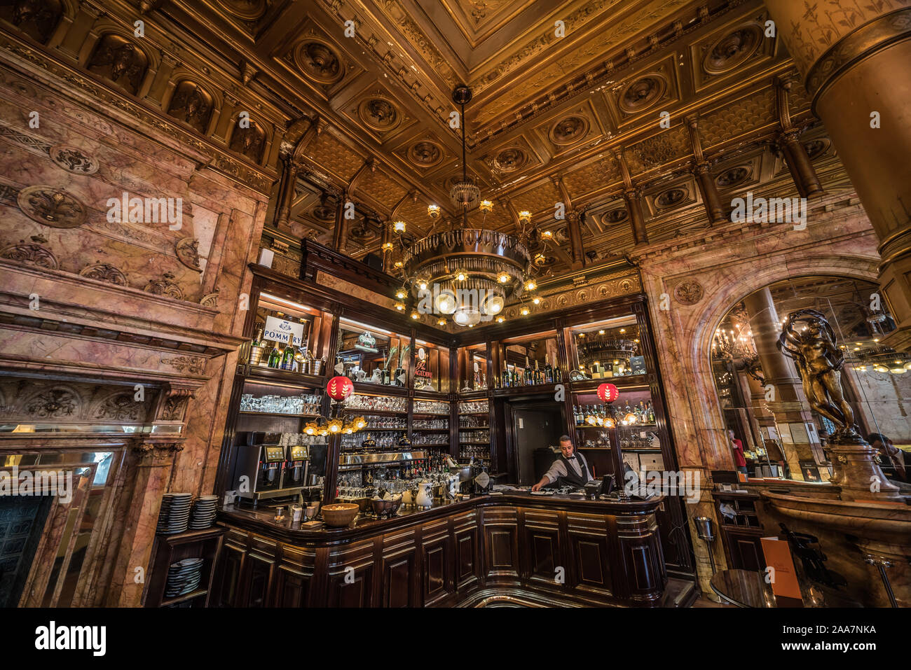 Eclectic interior design of the bar with golden ornaments and stained ...
