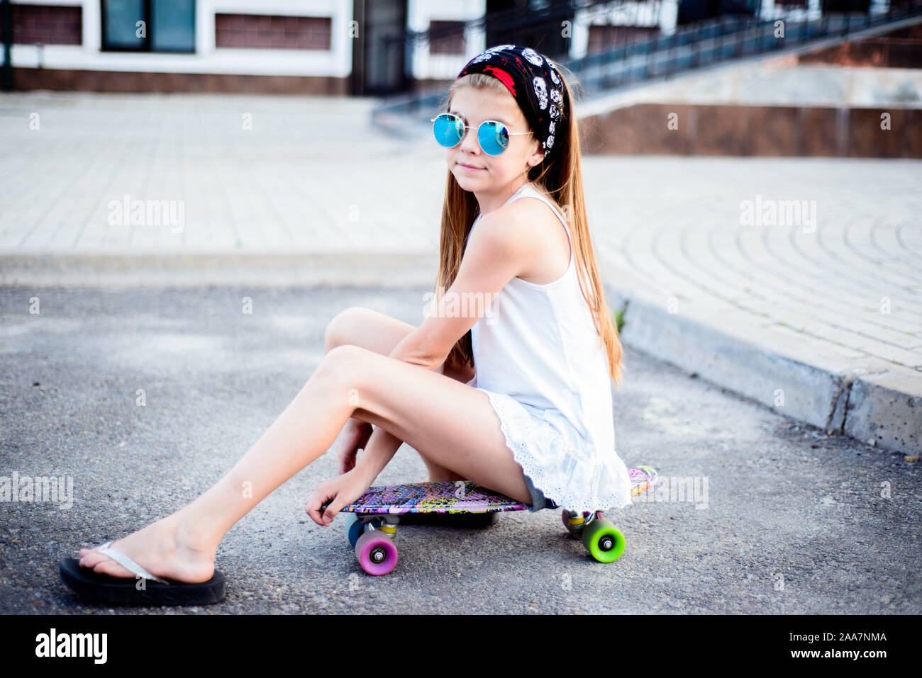 11-12 Years Old Tween Girl Wearing Fashion Sportswear Rollerskating On  Skateboard In The City Street, Urban Hipster Style Stock Photo, Picture and  Royalty Free Image. Image 93530637.