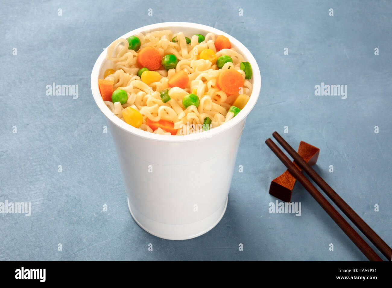 Ramen cup closeup, instant soba noodles in a plastic cup with green
