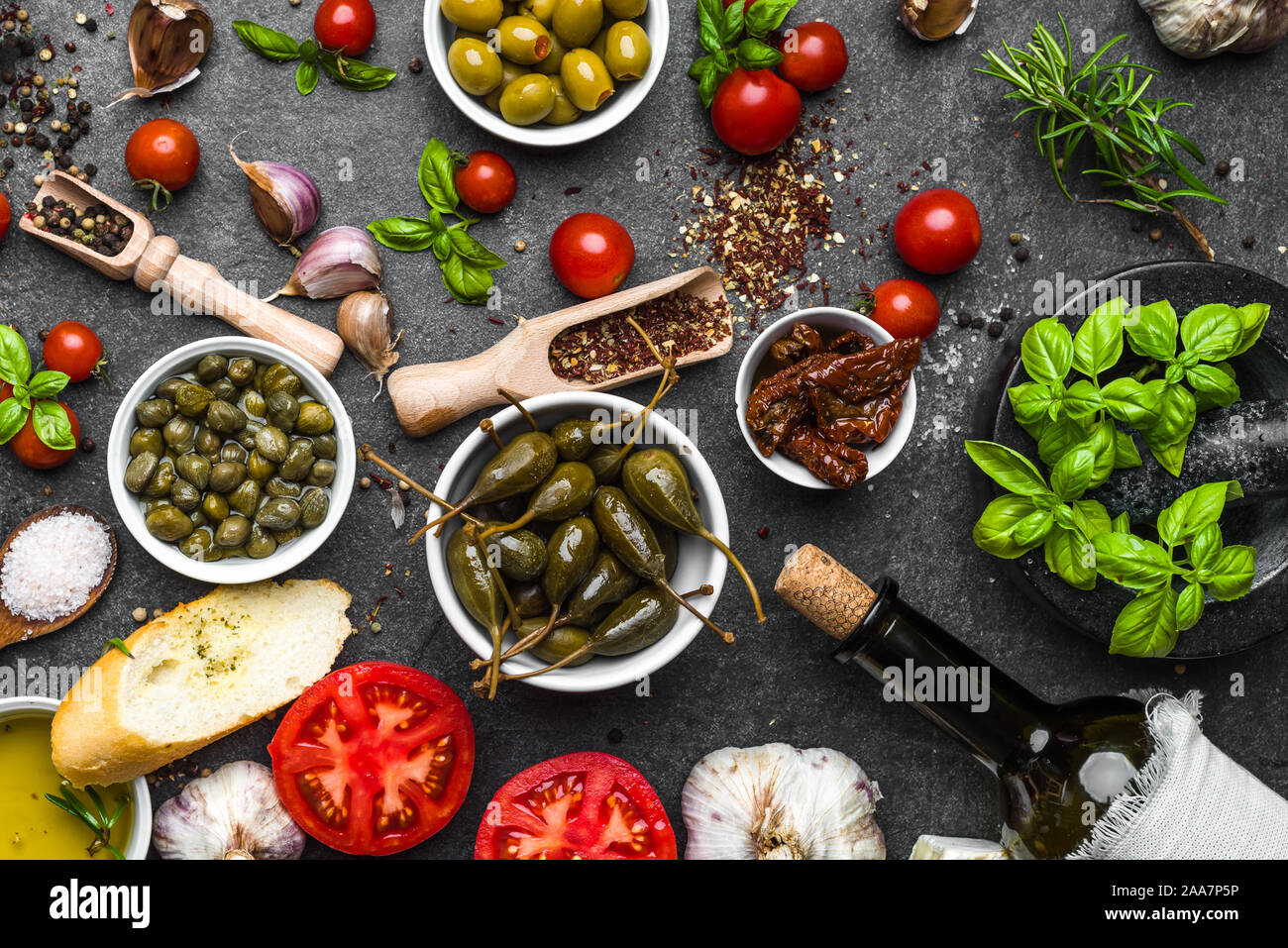 Mediterranean diet background. Cooking ingredients on dark slate Stock ...