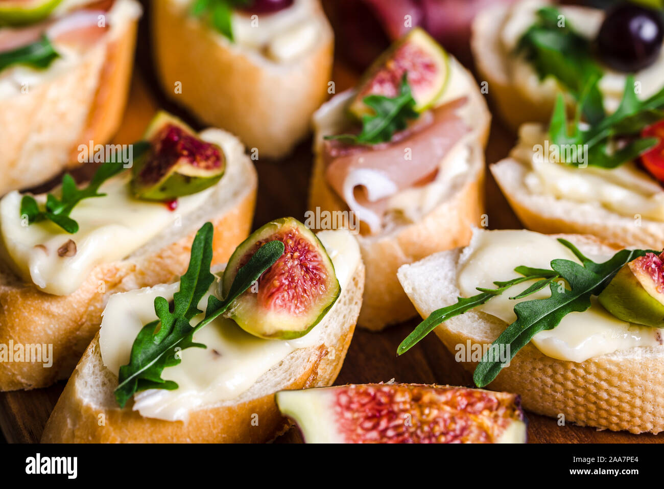 Traditional tapas from spain or italian bruschetta with cheese, meat