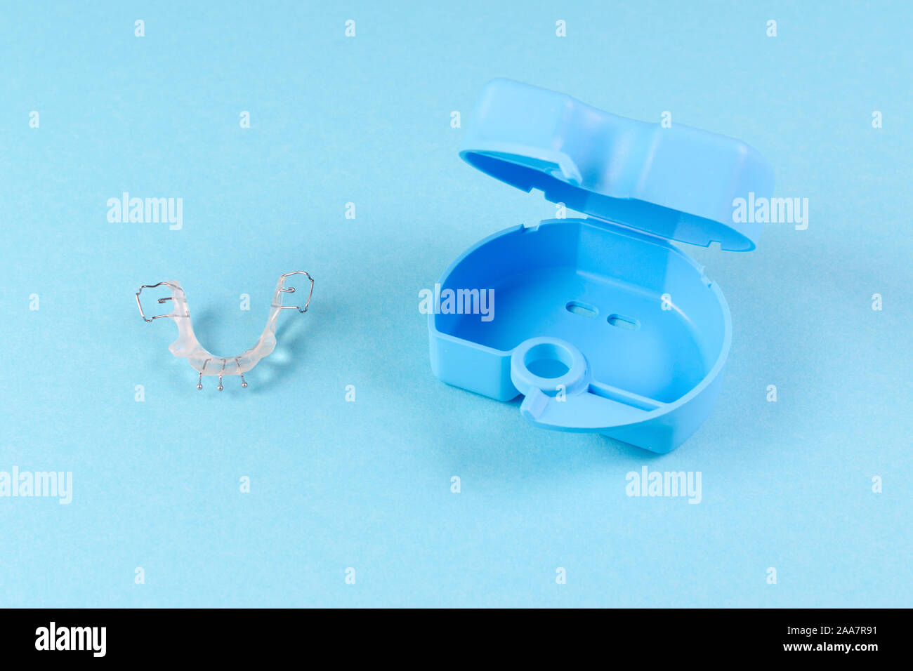 orthodontic appliance for correction of teeth with a box, on blue background Stock Photo Alamy