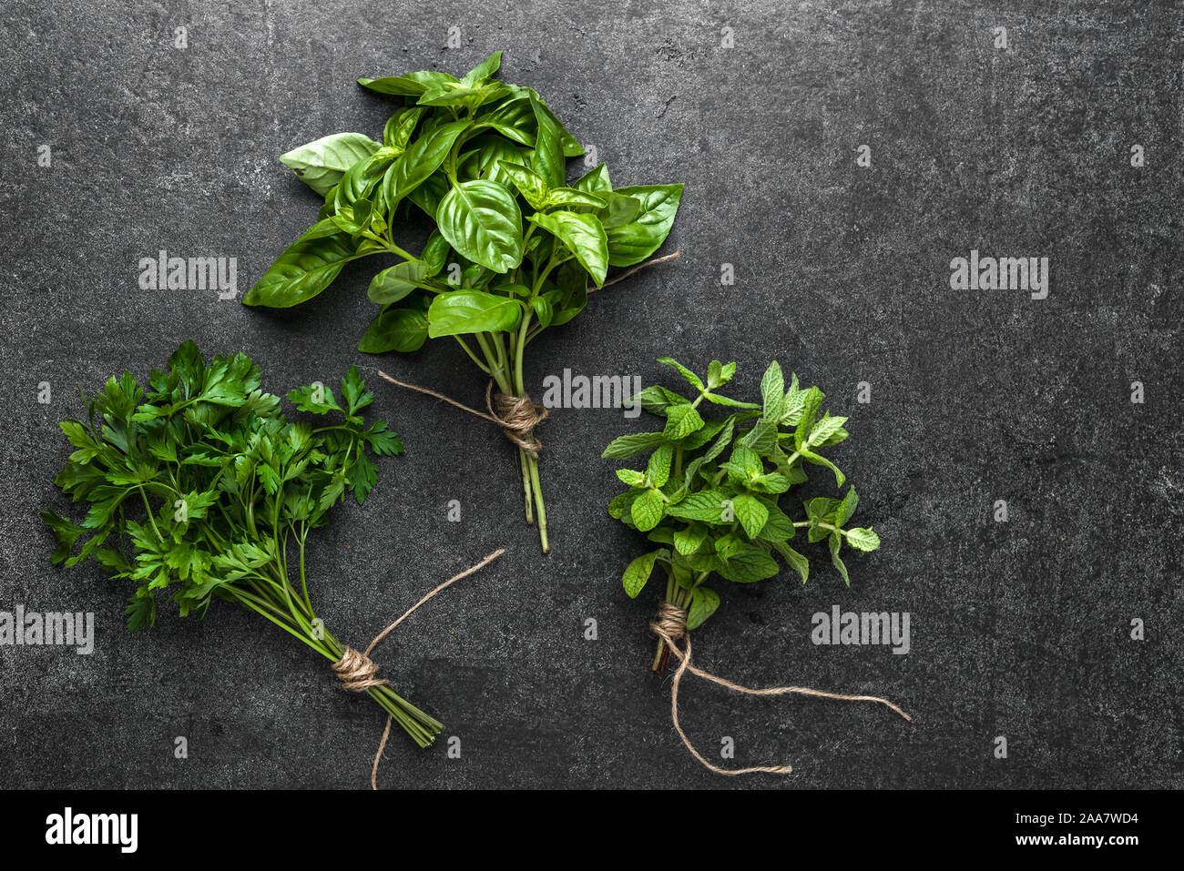 Fresh herbs bunch on dark background Stock Photo Alamy