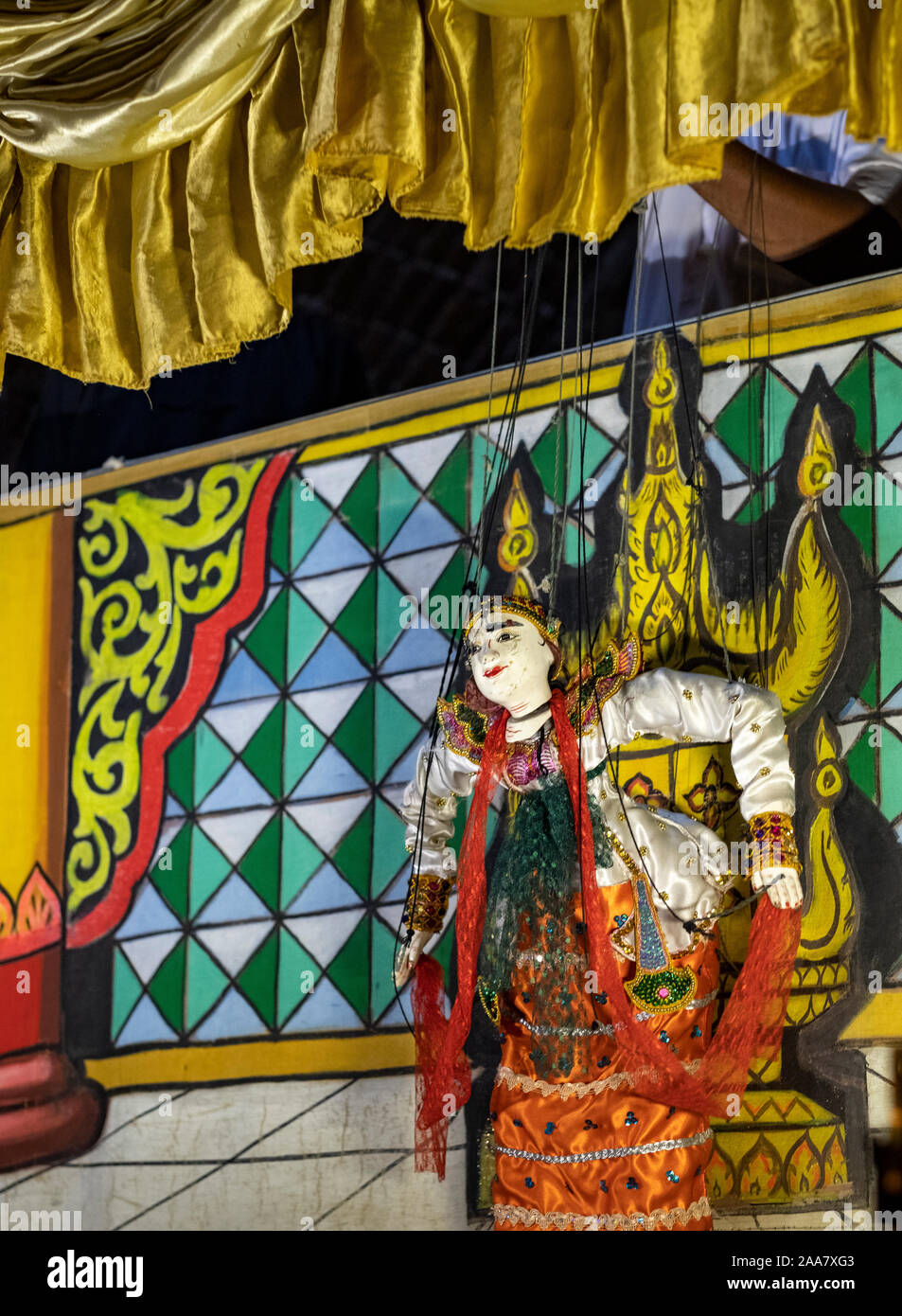 Colorful puppet theater with puppets representing Buddhist allegories and performed by experienced puppeteers behind a curtain in Bagan, Myanmar/Burma Stock Photo