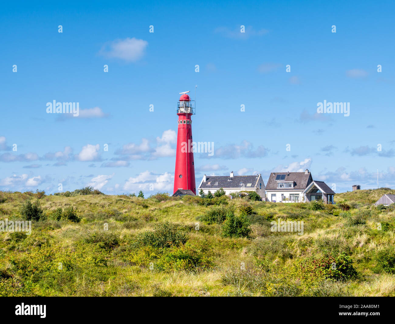 Lighthouse North Tower and houses in Westerduinen dunes on Frisian island Schiermonnikoog, Netherlands Stock Photo