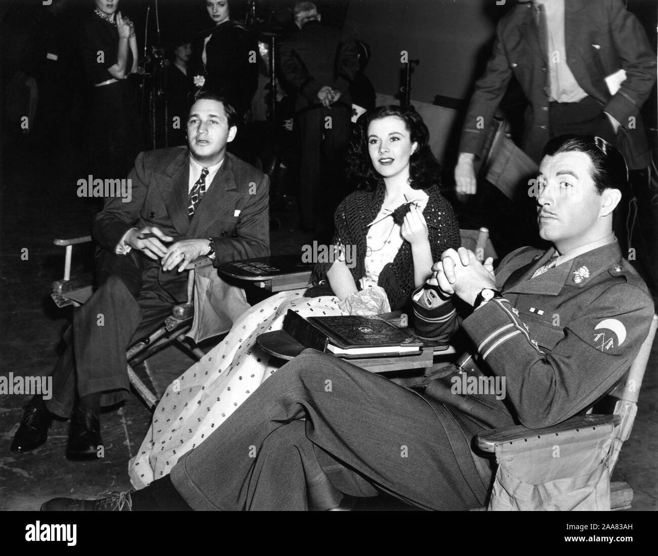 Director MERVYN LeROY VIVIEN LEIGH in costume as Myra and ROBERT TAYLOR in costume as ROTY CRONIN on set candid during filming of WATERLOO BRIDGE 1940 director Mervyn LeRoy play Robert E. Sherwood Metro Goldwyn Mayer Stock Photo
