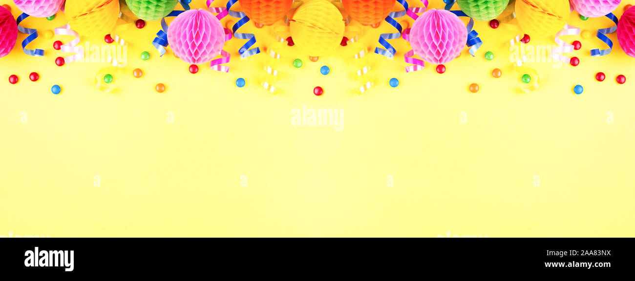 Birthday party banner on yellow. Top view. Border made of colorful ...