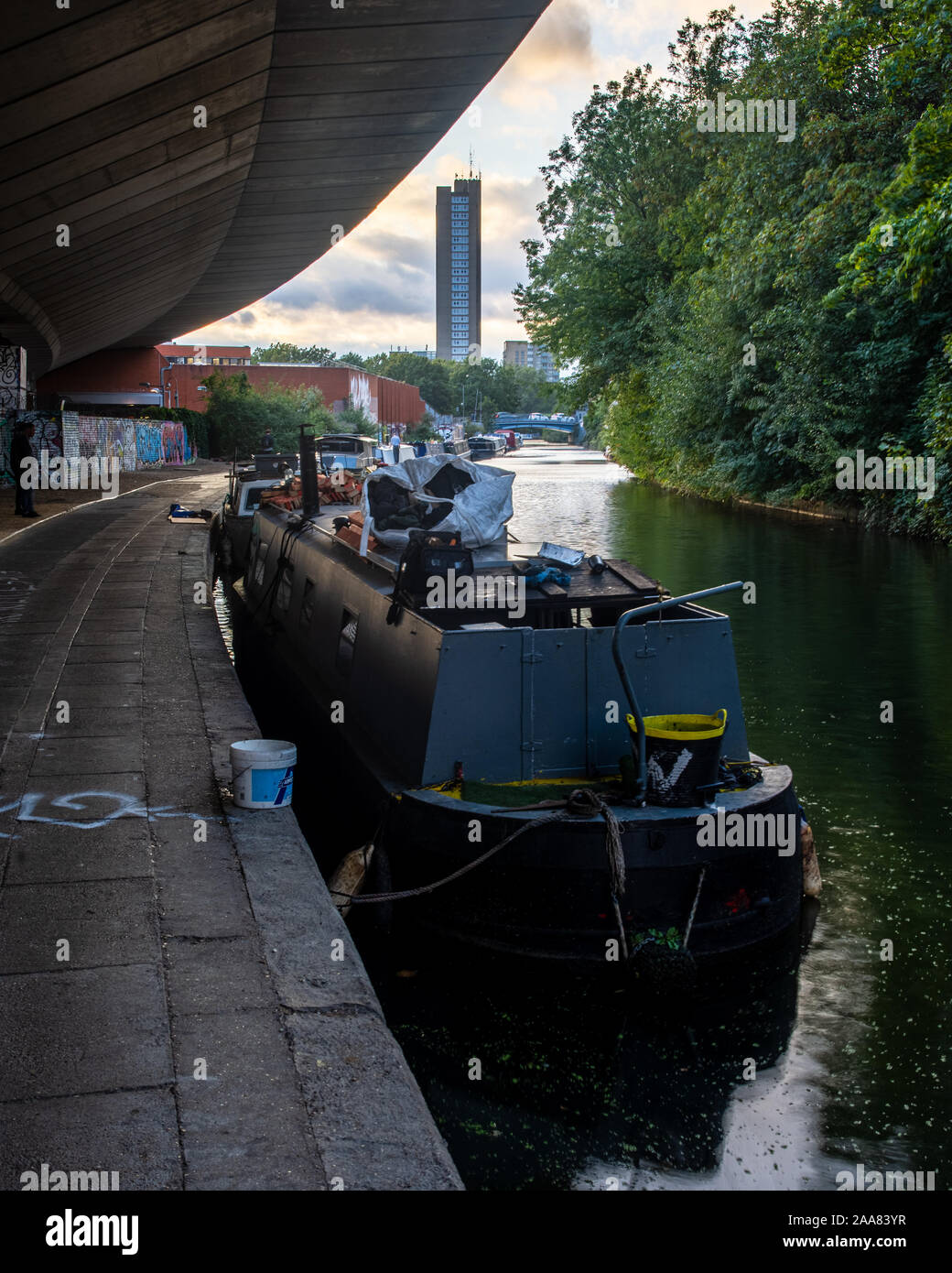 London, England, UK - September 12, 2019: Traditional narrowboats are moored on the Grand Union Canal under the Westway flyover in West London. Stock Photo
