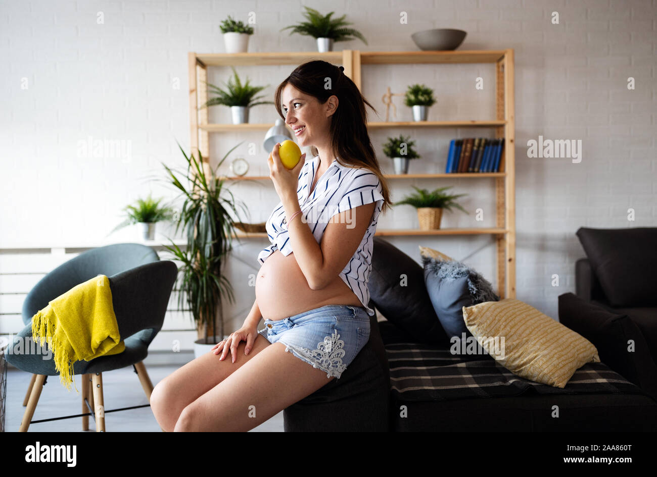 Beautiful pregnant woman expecting baby with love Stock Photo