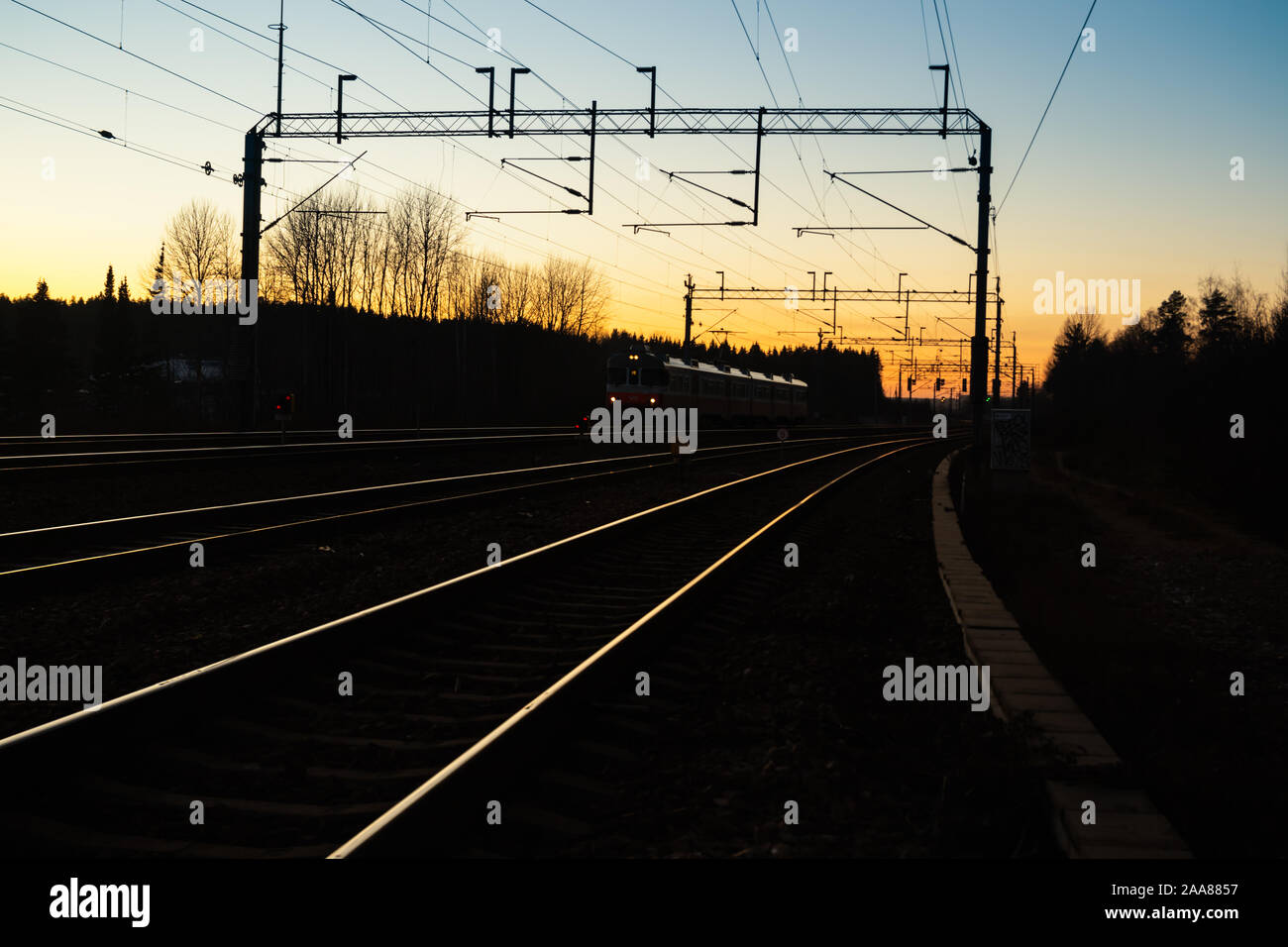 Kouvola, Finland - 15 November 2019: Train and railway at beautiful sunset background. Stock Photo