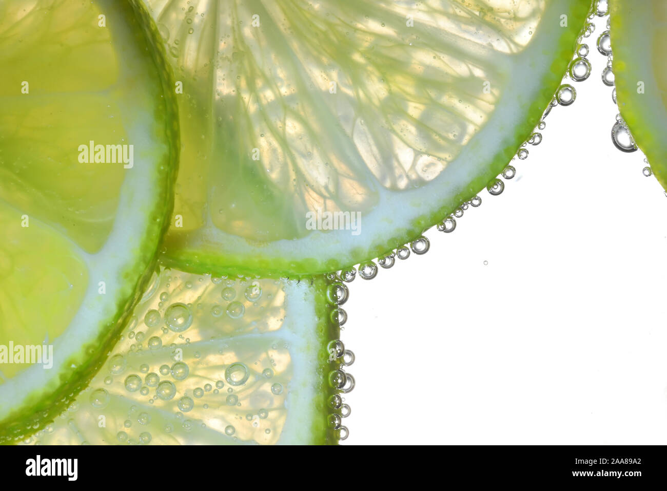 Lemon Slices In Water With Air Bubbles Stock Photo