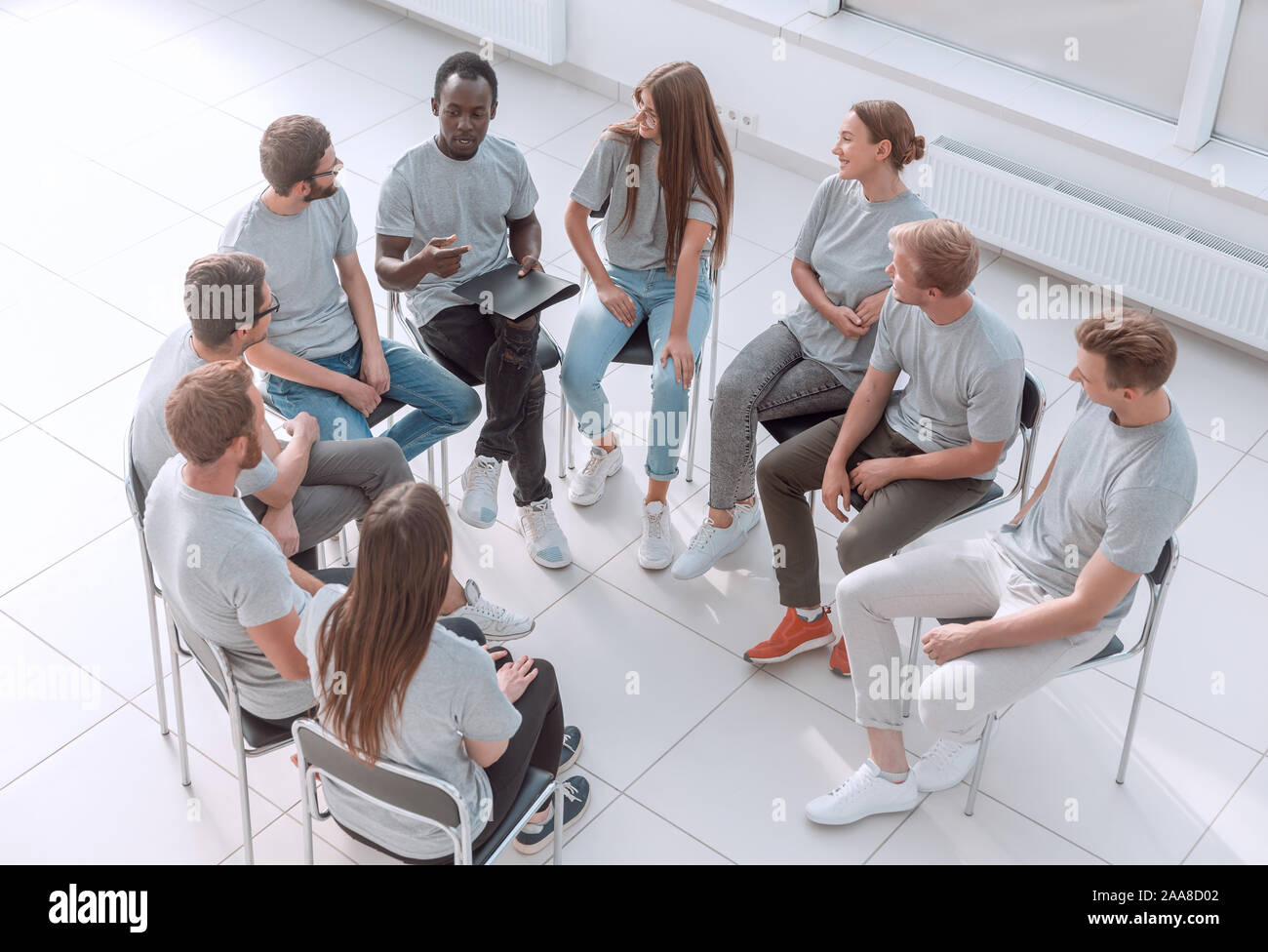 top view. discussion group of young people sitting in a circle Stock