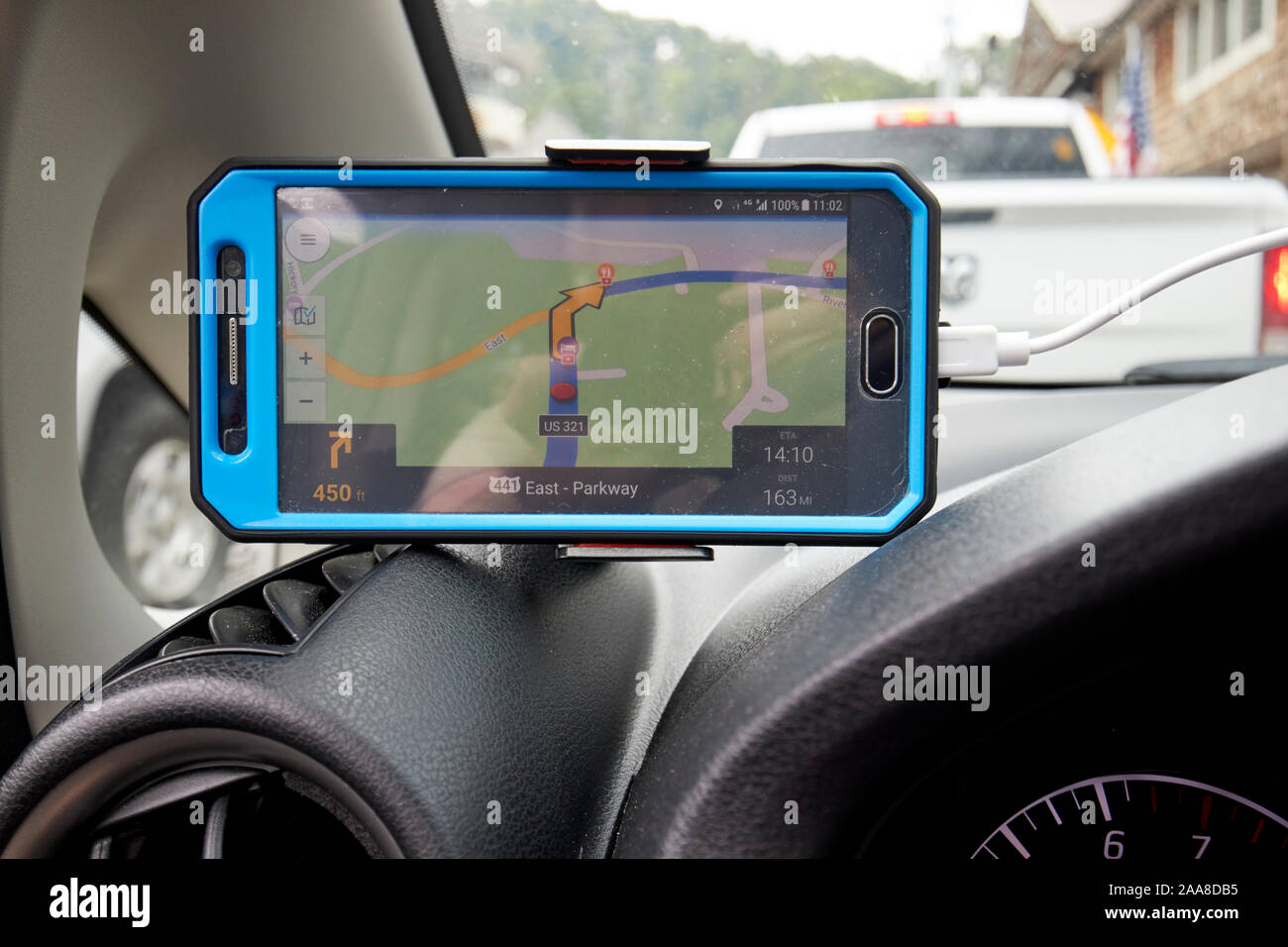 using cellphone as sat nav in traffic on busy us 441 through downtown Gatlinburg tennessee usa Stock Photo