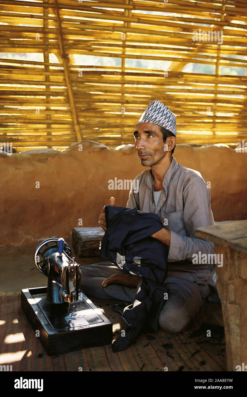 The village tailor and his wife in the village of Sultibari in east Nepal Stock Photo