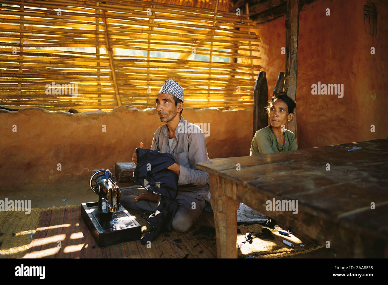 The village tailor and his wife in the village of Sultibari in east Nepal Stock Photo