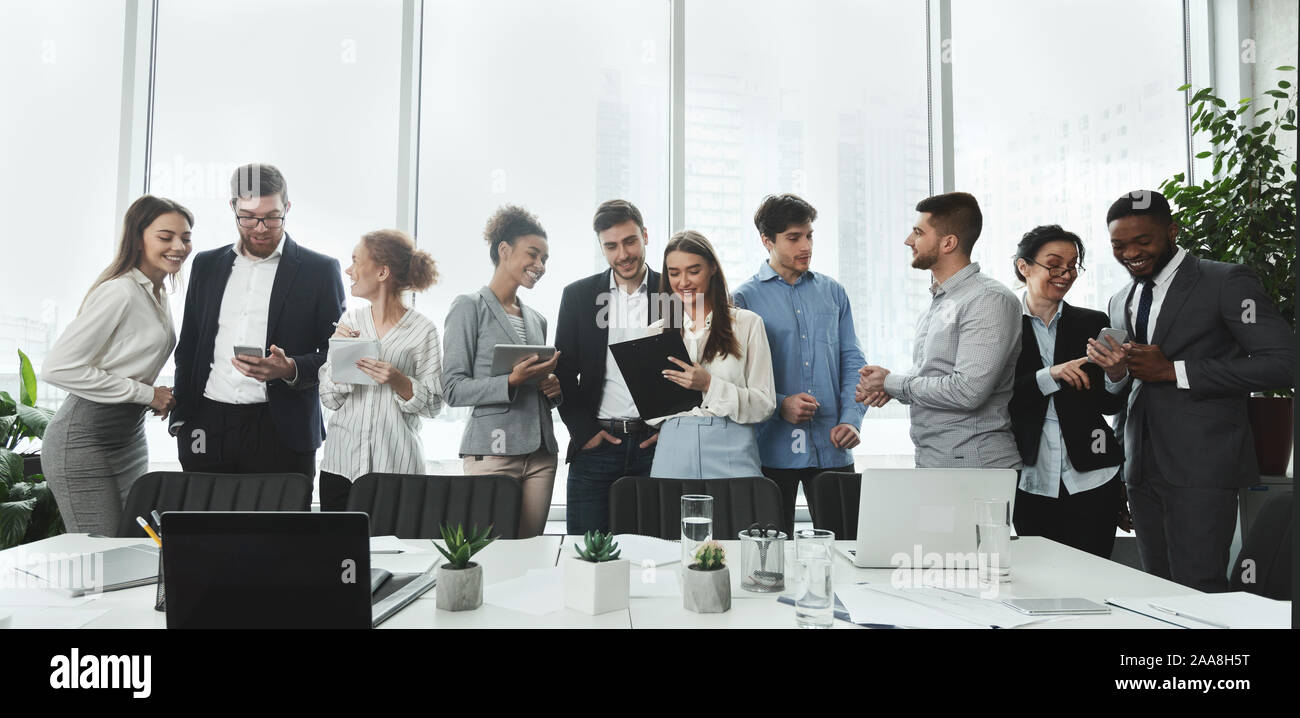 Successful business team talking in conference room Stock Photo