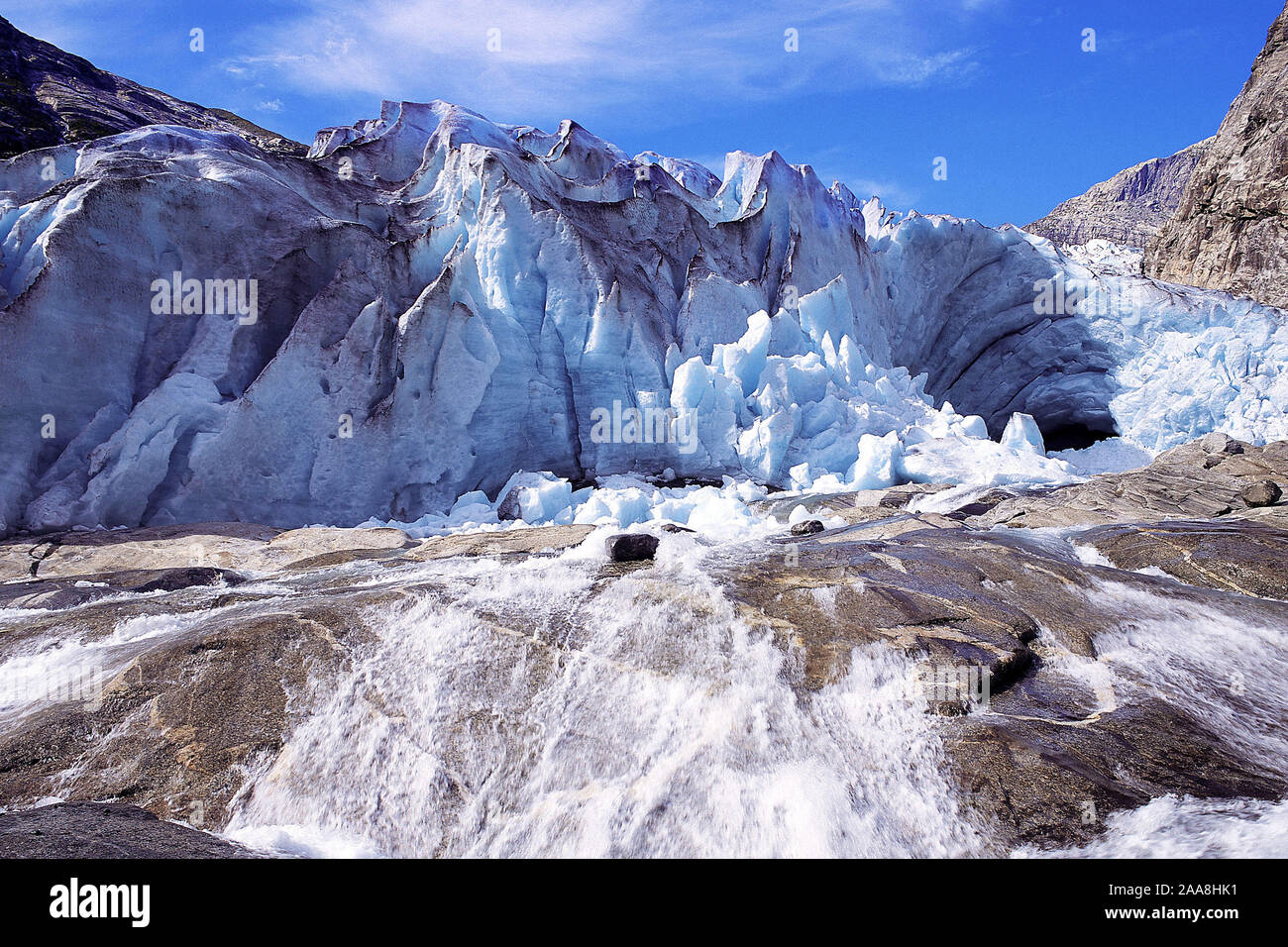 A vigourous melt-water stream issuing from the snout of the Nigardsbreen glacier, Jostedal National Park, Norway Stock Photo