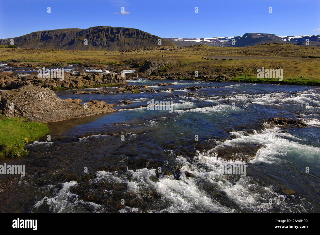 Rapids on the Laxa river, Hvalfjordur, west Iceland, with the Medalfell hills behind. Stock Photo