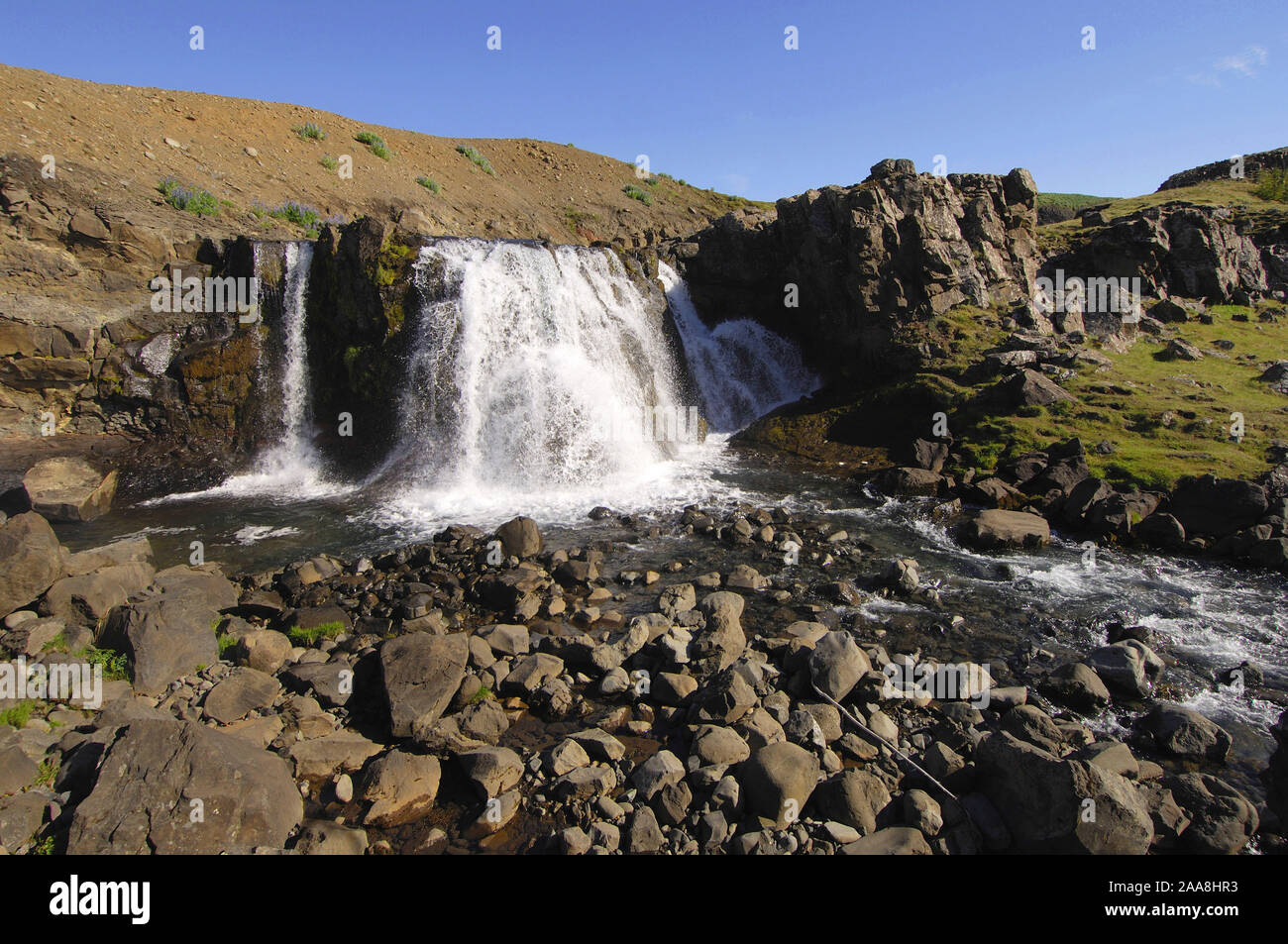 Waterfall and rocky stream-bed, Hvalfjordur, west Iceland. Stock Photo