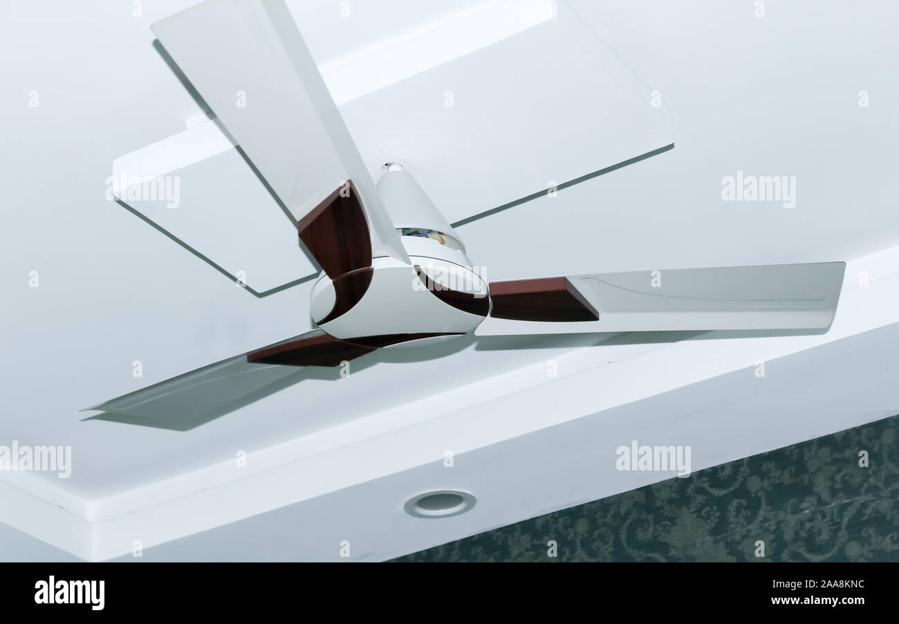 Close Up Of A White Ceiling Fan Or Electric Loft Fan Fitted
