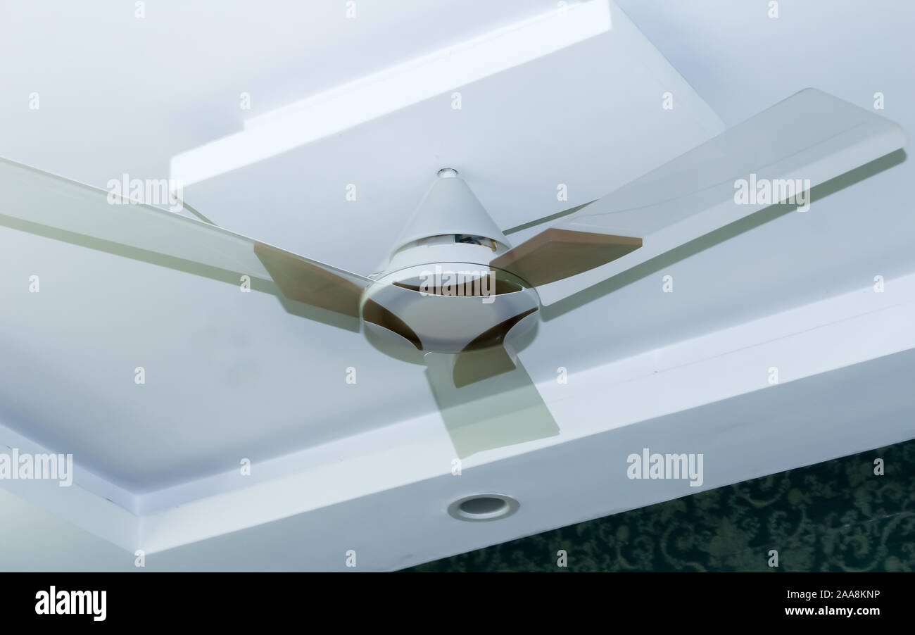 Close Up Of A White Ceiling Fan Or Electric Loft Fan Fitted On The