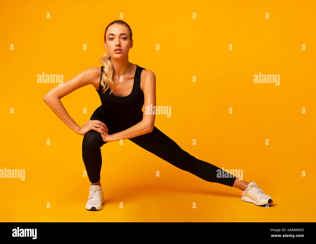 Workout with personal trainer. Instructor helping girl in gym Stock Photo  by Prostock-studio