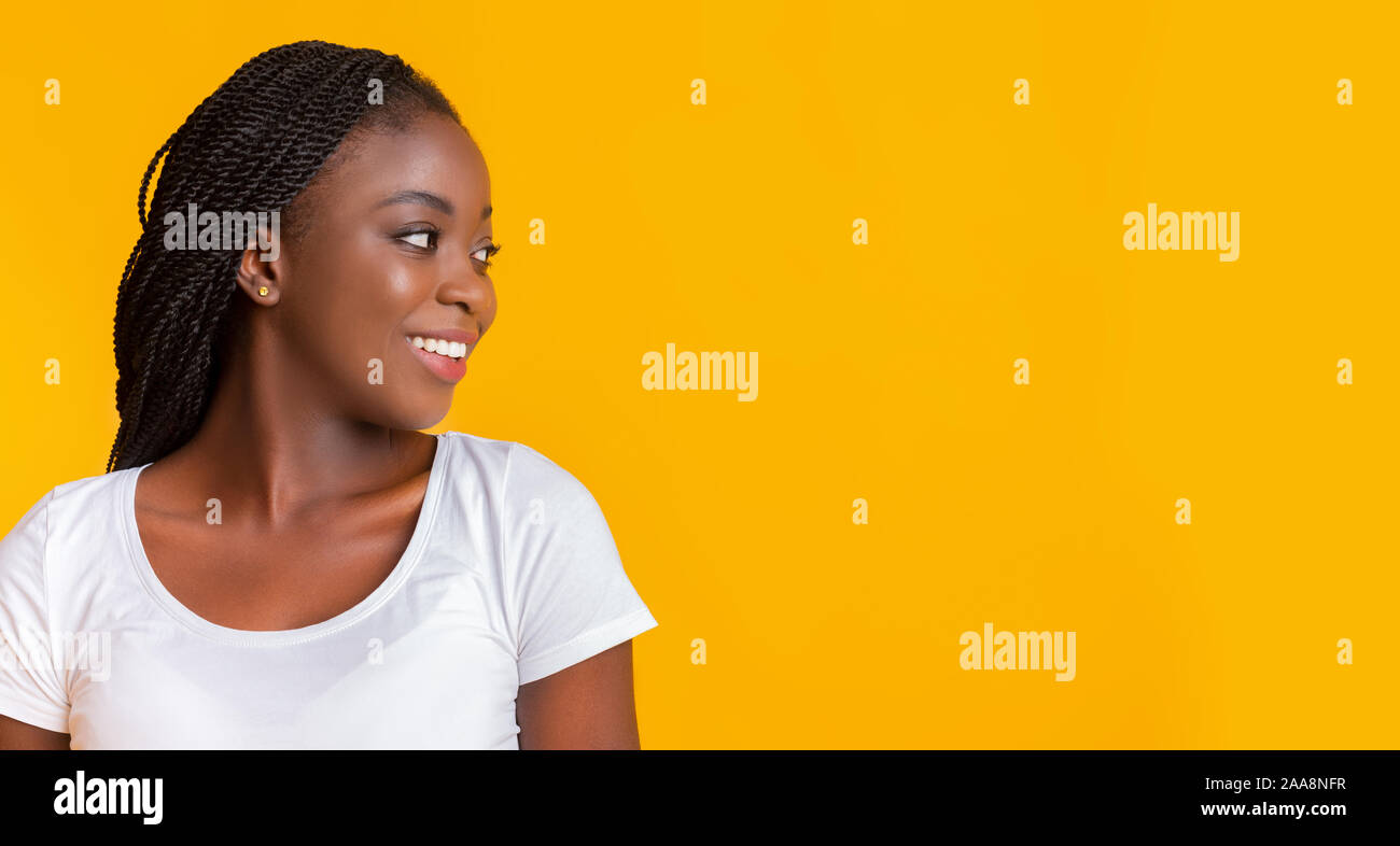 Smiling african american woman looking at copy space Stock Photo