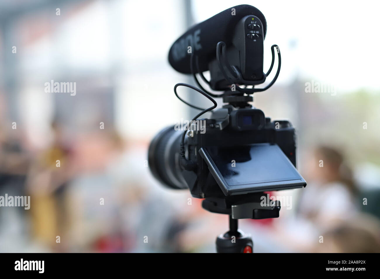 camera with a professional microphone, tripod camera Stock Photo Alamy