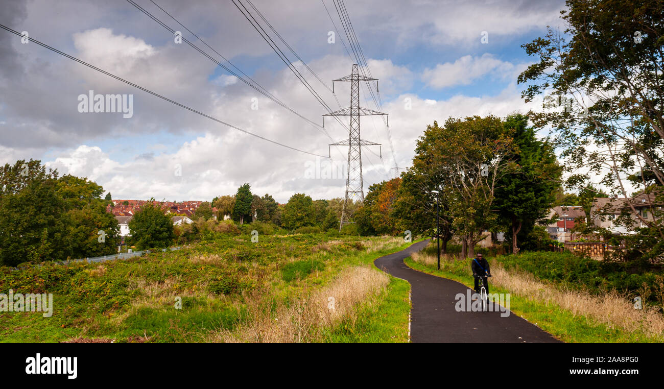 Bristol, England, UK - October 3, 2012: A cyclist rides on a new cycle path in Lockleaze in the northern suburbs of Bristol. Stock Photo