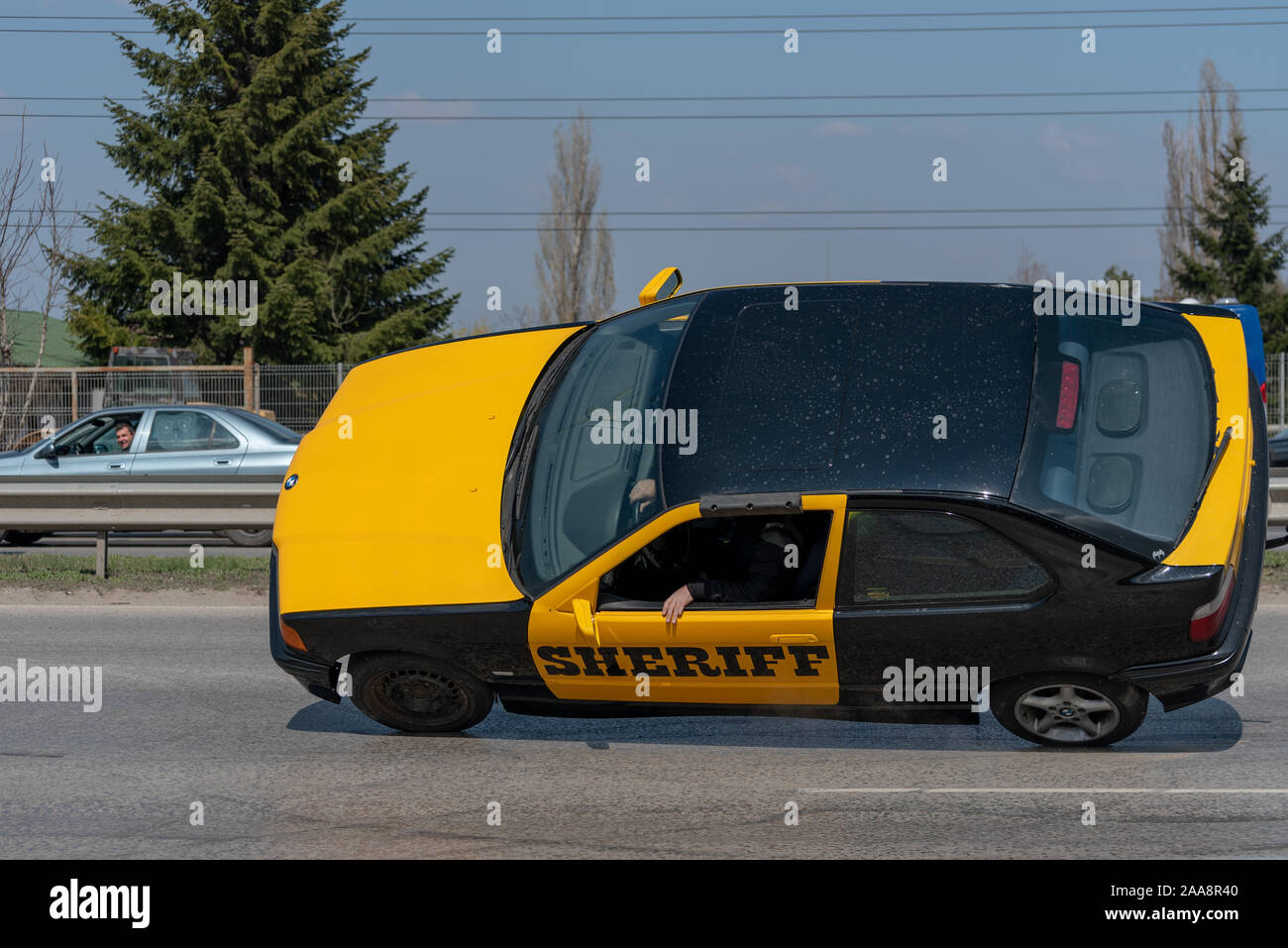 Car on two wheels Stock Photo Alamy