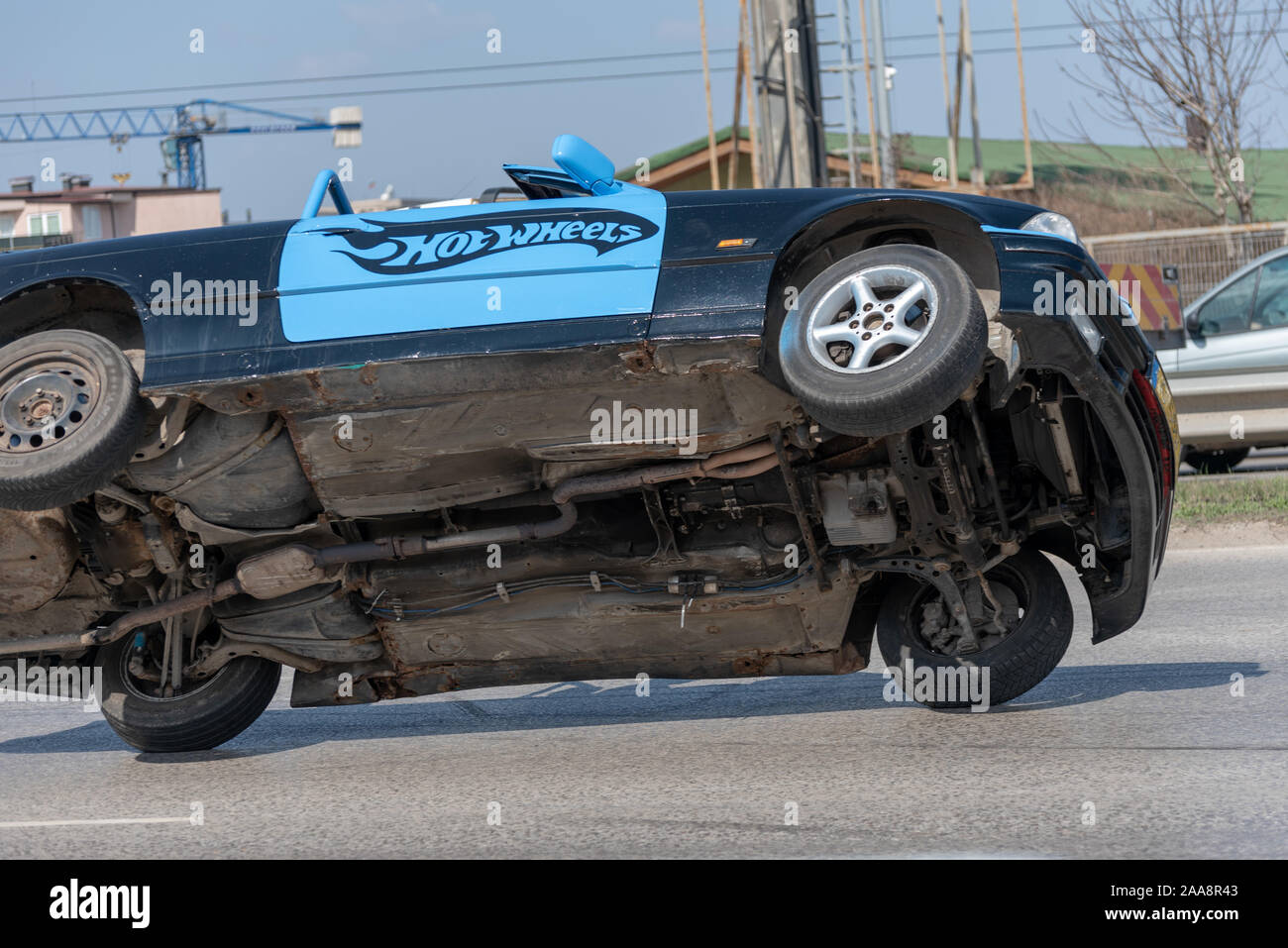 Car on two wheels Stock Photo Alamy
