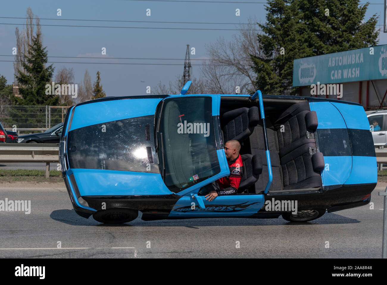Car on two wheels Stock Photo Alamy