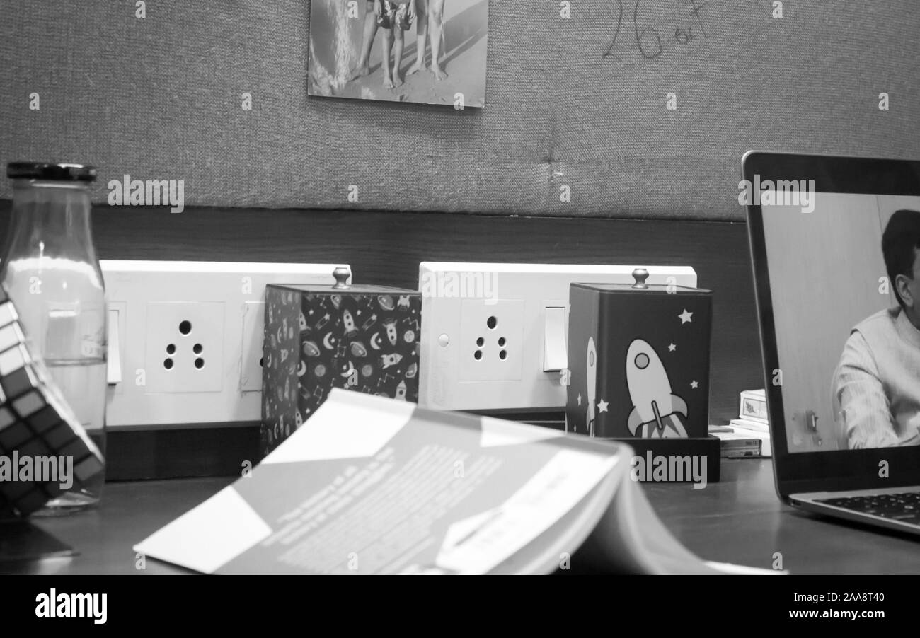 A Modern study desk for a High School Student. Laptop, Books, pen and