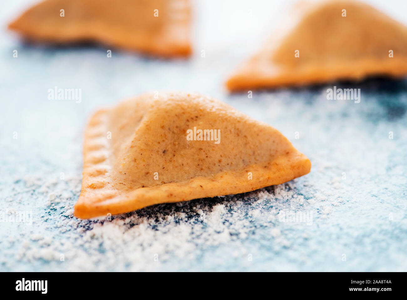 high angle view of some Indian samosas on a marbled stone surface Stock Photo