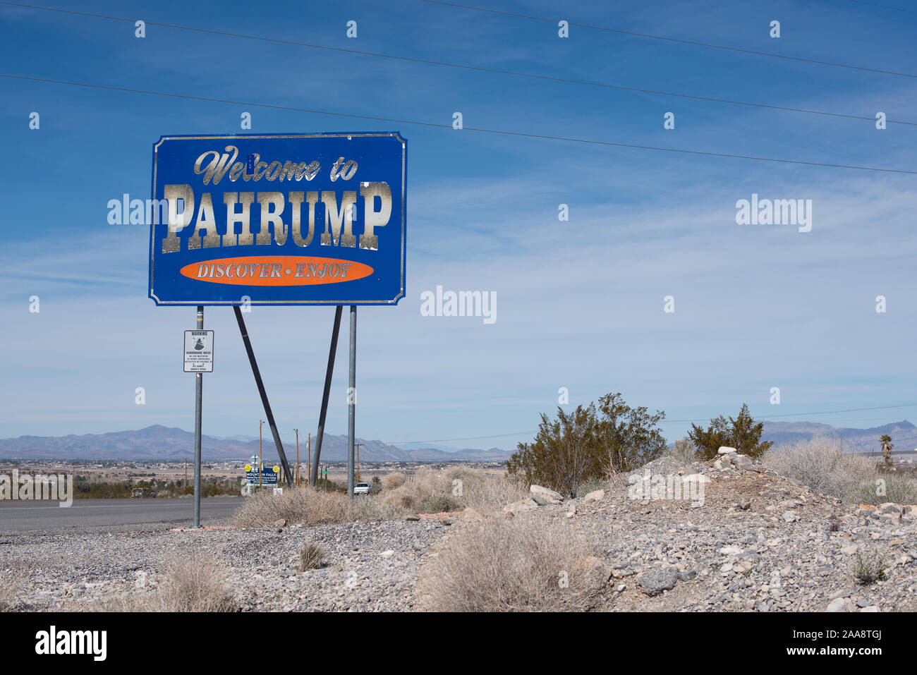 Welcome to Pahrump sign on two lane highway in Nevada Stock Photo