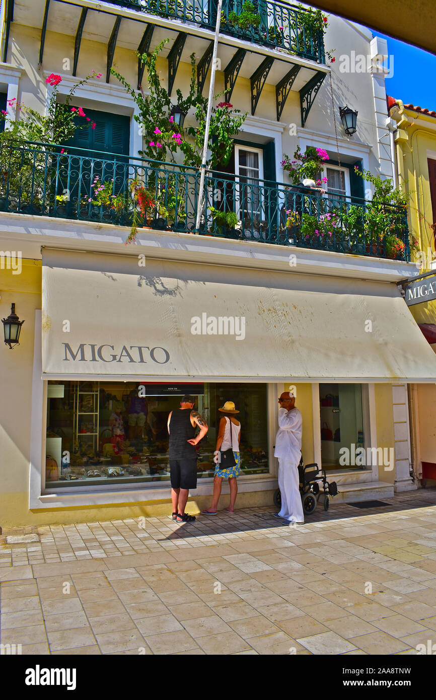 A view of the Migato fashion shop in Lithostroto, the main shopping street  in the centre of the capital town, Argostoli. Greek man in white clothing  Stock Photo - Alamy