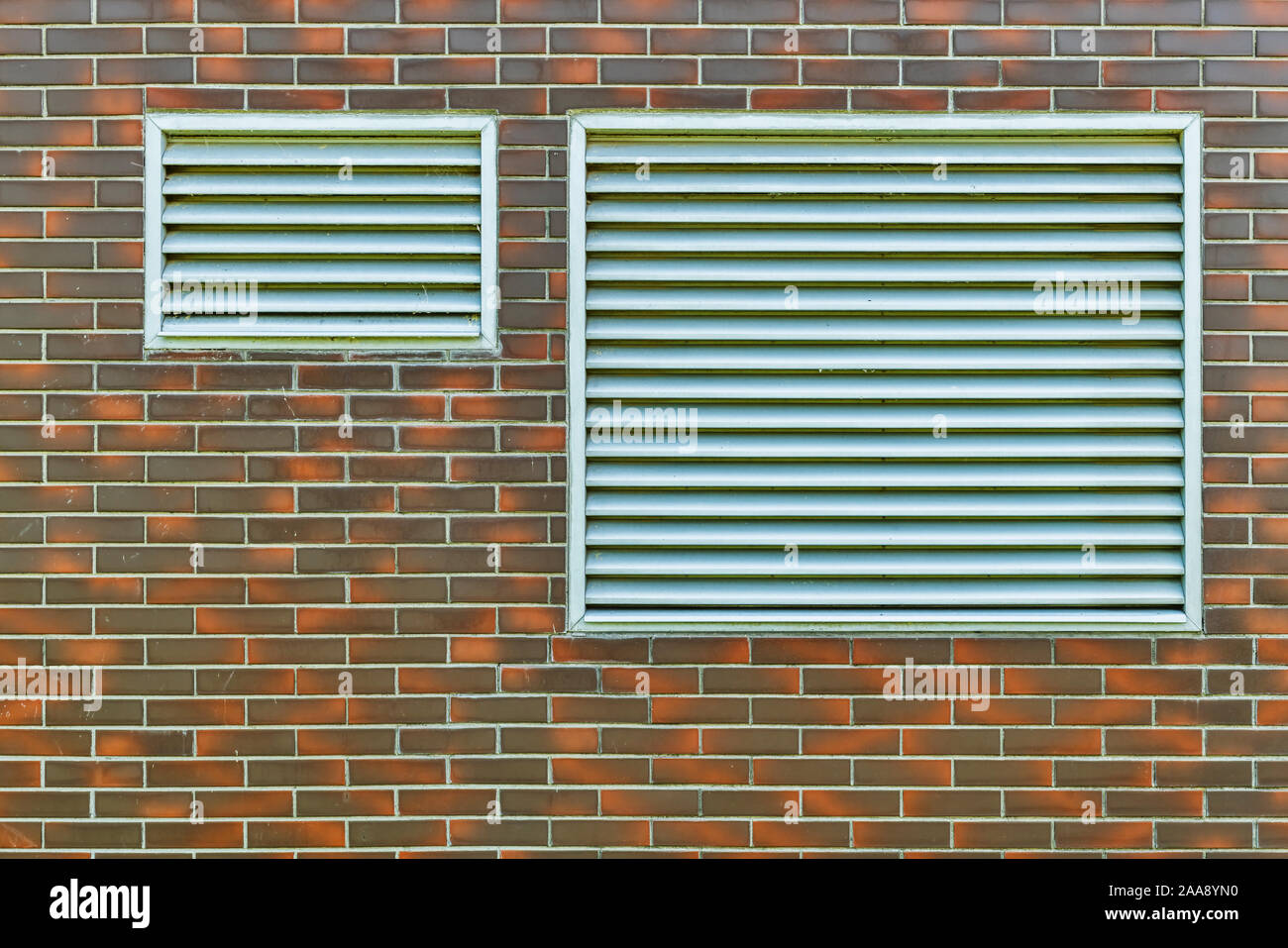Two ventilation grilles on an estate building Stock Photo