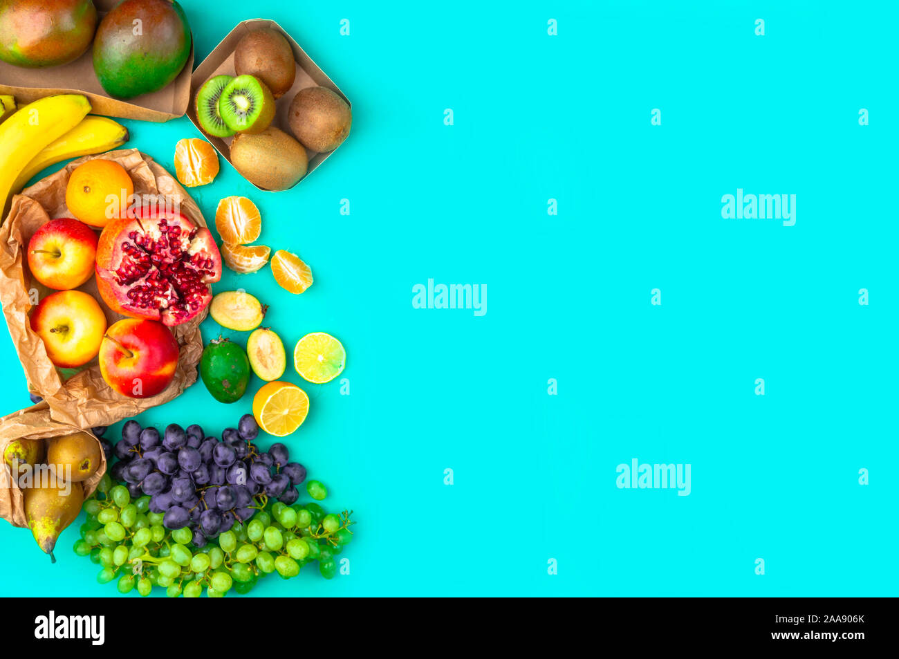 Fruits and vegetables rich in antioxidants, vitamin and fiber on blue