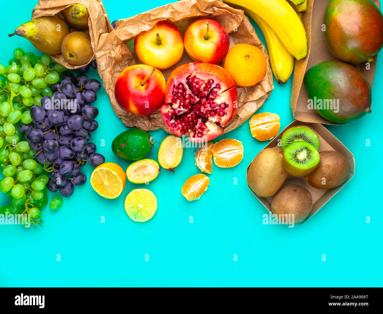 Fruits and vegetables rich in antioxidants, vitamin and fiber on blue